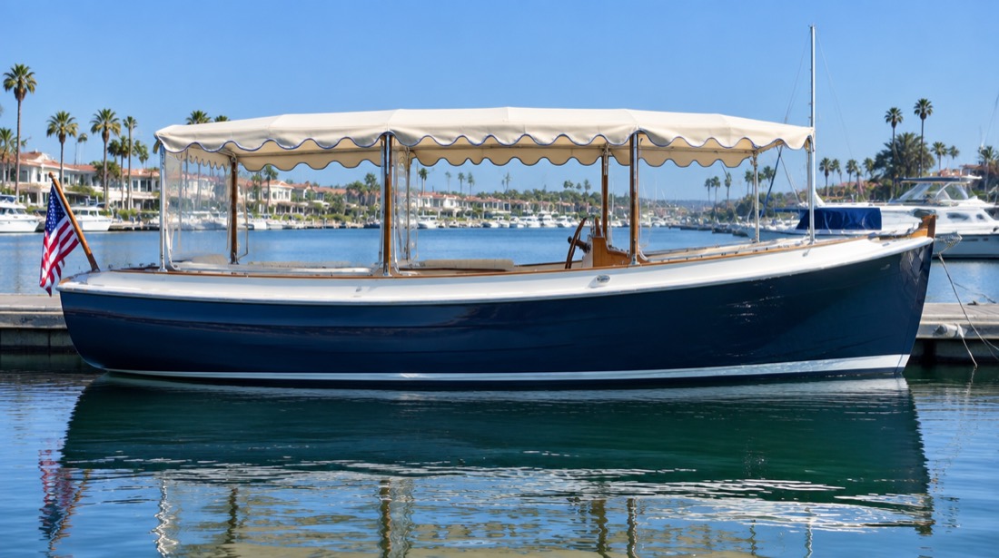 Navy hulled electric harbour cruiser moored at a dock